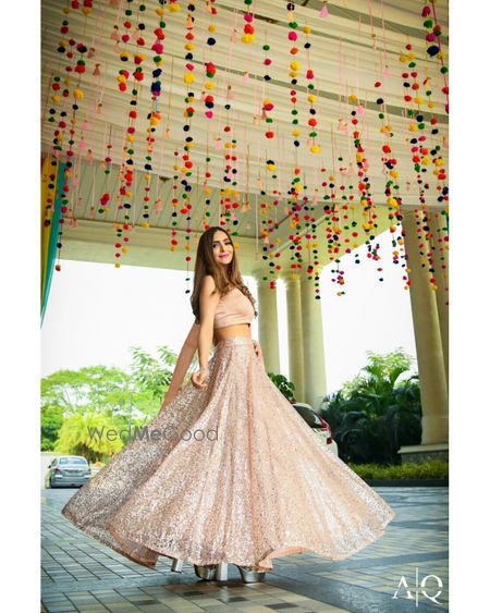 Hanging pompoms and twirling bride 