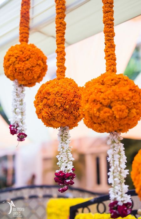 Suspended Genda Phool Balls with Floral Strings