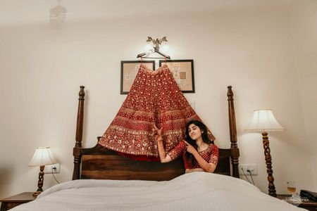 Bridal portrait idea with lehenga over bed 