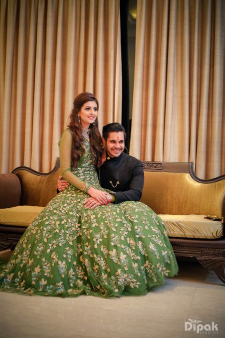 Green floor length engagement gown with floral motifs