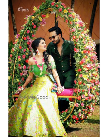 Couple portrait on mehendi with round swing decor 