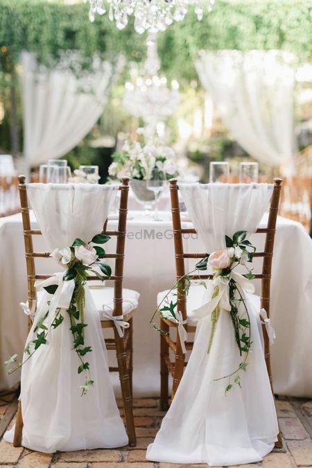 Simple yet stunning white floral chair decor