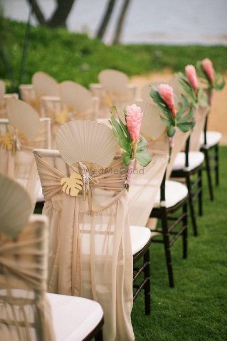 Morning wedding idea with fans in chair decor 
