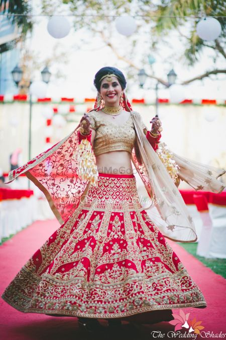 Red and gold bridal lehenga with sequin work