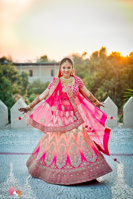 Ombre bridal lehenga in peach and bright pink