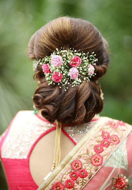 Bridal bun with babys breath and flowers 