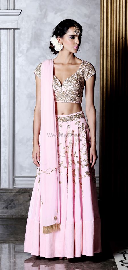 Pink and gold lehenga with deep cut blouse