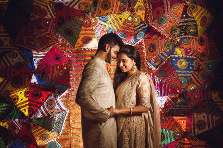 A color coordinated couple shot against a vibrant backdrop.