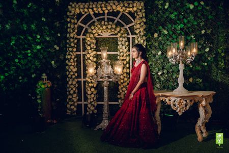 Photo of A stunning bride to be in an alluring maroon lehenga.
