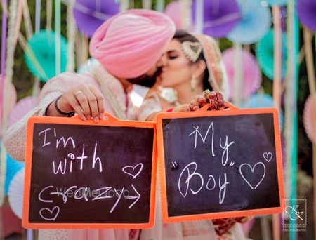 Photo of Wedding day couple portrait with prop