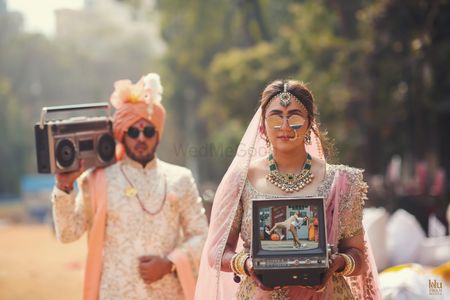 Modern bridal couple portrait wearing sunglasses 