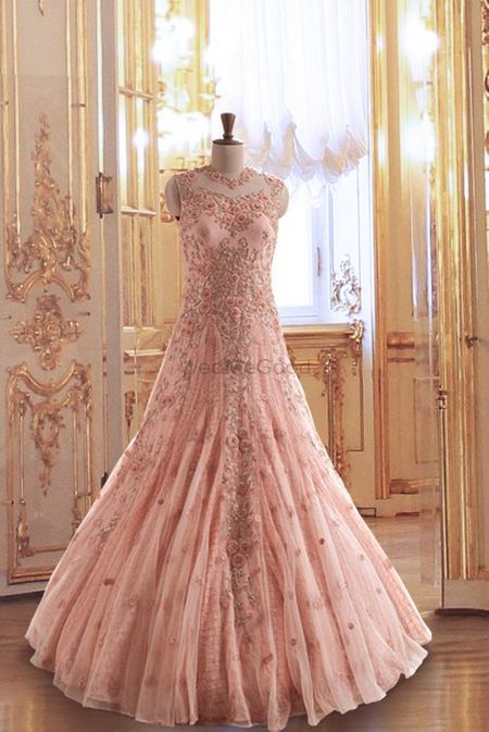 Photo of embroidered blush pink floor length fown