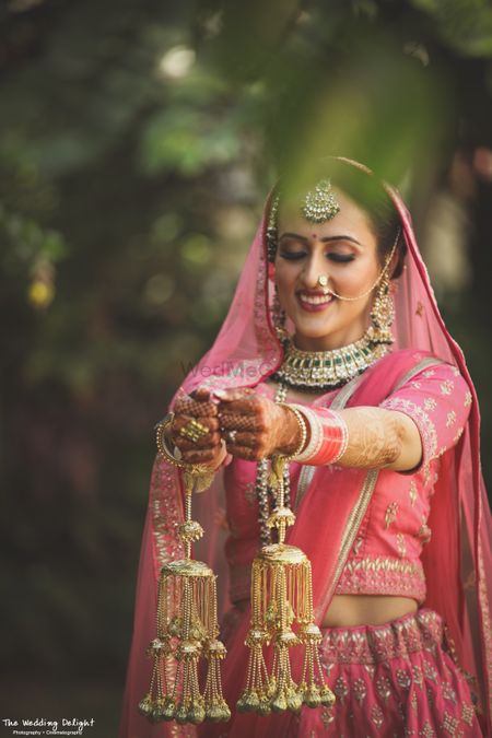 Bride in pink showing off kaleere 