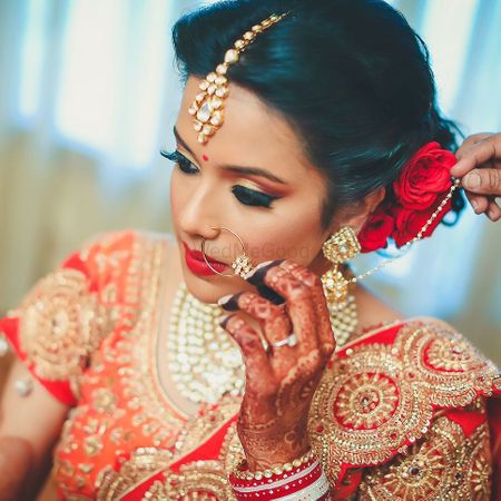 Bridal Makeup with Red Lehenga and Hairstyle with Roses