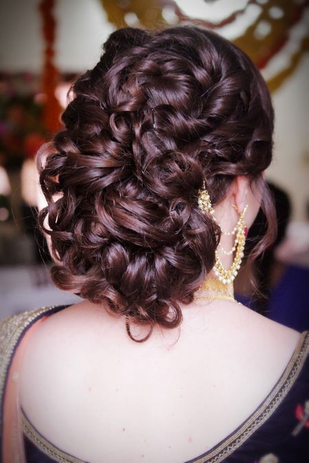 Wavy bun hairstyle for bride sister or mother