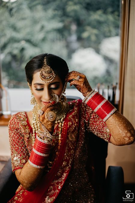Photo of Bride getting ready shot wearing Nath