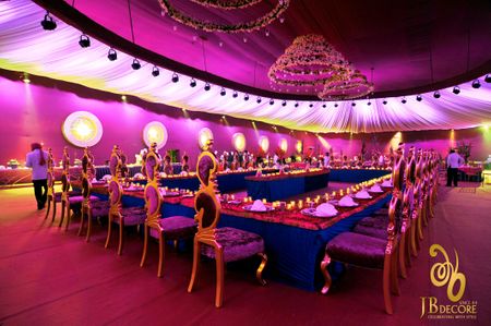 Photo of Purple and gold royal table setting