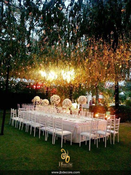 Photo of Magical table setting in white with suspended florals