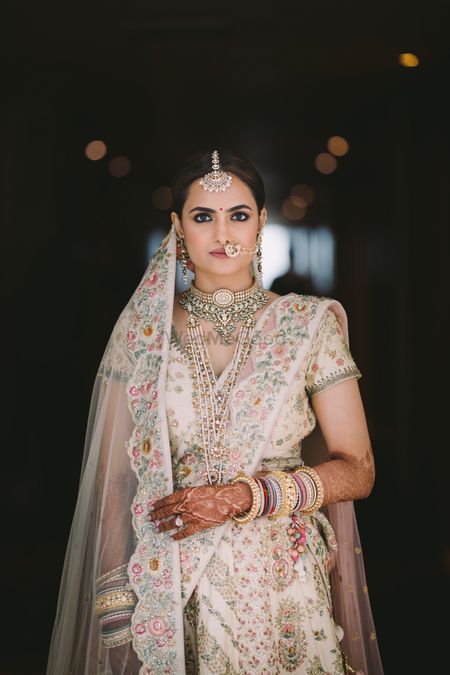 Offbeat bridal lehenga in ivory with silver jewellery