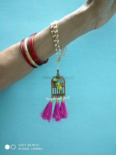 Photo of Parrot bangles with birdcage as mehendi favours