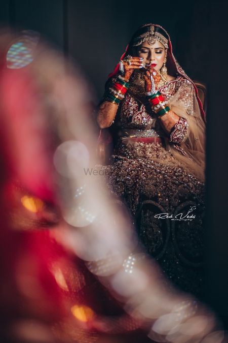 Mirror shot with bride wearing nath 
