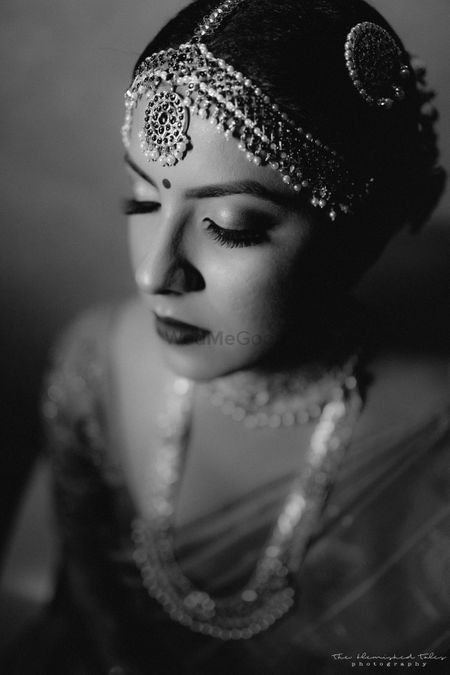 Photo of Black & white south Indian bridal portrait.