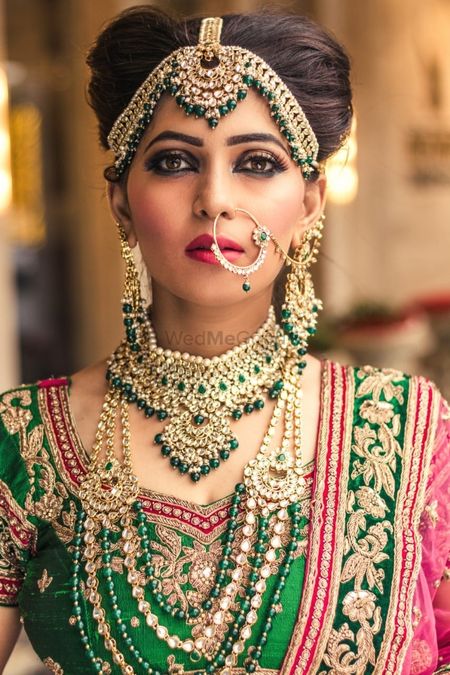 Photo of Heavy bridal mathapatti and layered necklaces