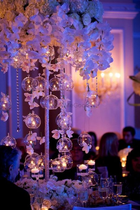 Pretty decor idea with white flowers and hanging balls