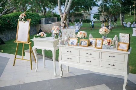 Photo display idea with white and gold theme on entrance