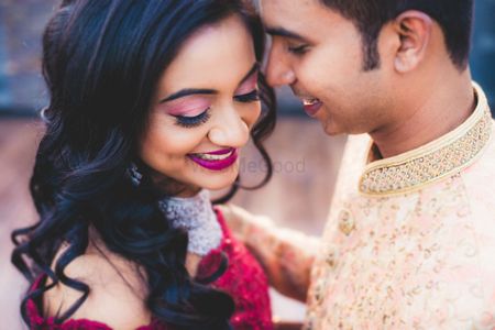 pink eye makeup with deep red lipstick for engagement