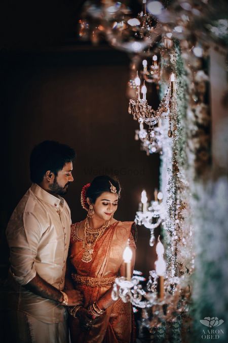South indian couple shot with candle lit decor 