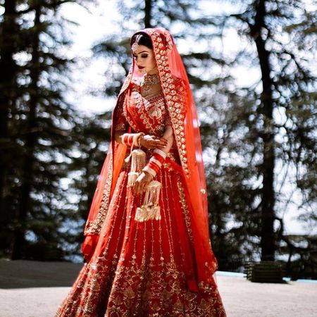 Photo of modern bride in a red lehenga