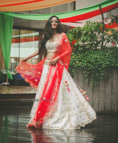 Photo of white and red lehenga