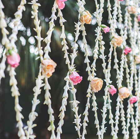 Pretty floral decor with pink and orange flowers for wedding 
