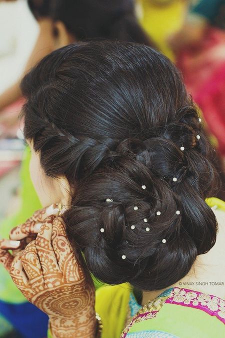 braided bun hairstyle diamond crystals in hairdo