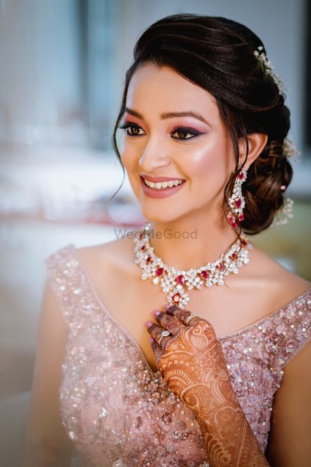 Glowing makeup with side bun for sangeet