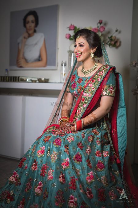 Bridal lehenga in red and teal with floral embroidery 