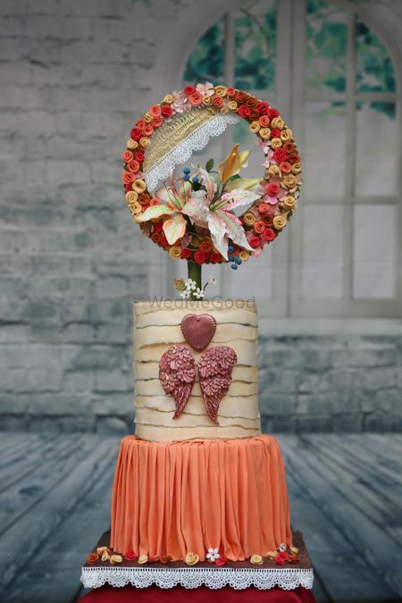 Photo of Pretty engagement cake with floral cake topper