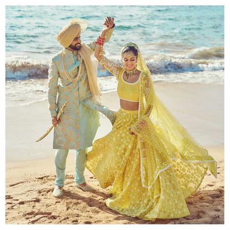 Photo of Pastel bride and groom outfits mint and yellow