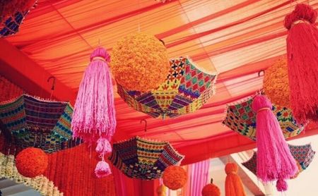 Photo of Pretty decor tassels, hanging genda balls and umbrella