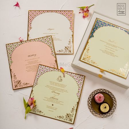 A simple boxed invite with Moroccan themed leaflets.