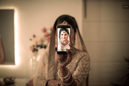 Unique bridal portrait with phone 