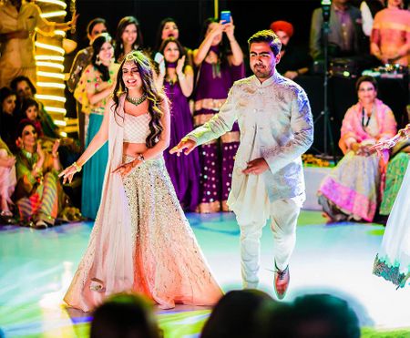 Bride and groom dancing on sangeet