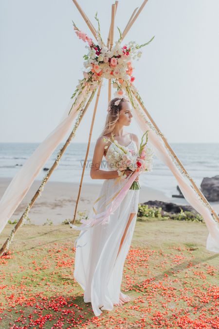 Beach wedding with glamping photobooth