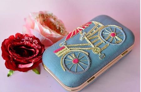 Photo of Pretty bicycle clutch for sangeet or mehendi function
