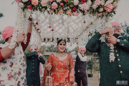 Bridal entry under a phoolon ki chaadar
