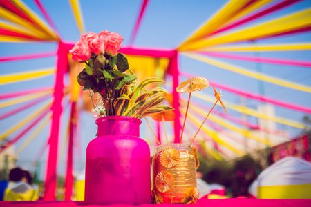 Ideas for mehendi centrepiece with yellow and pink decor