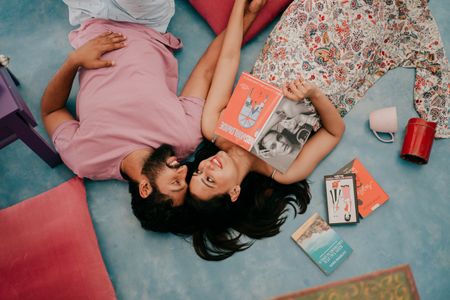 intimate pre wedding shoot idea at home with books