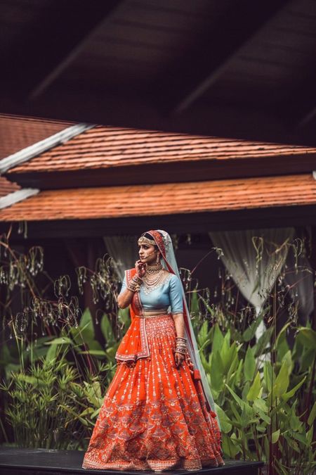 A bride in a lehenga with a contrasting blouse 