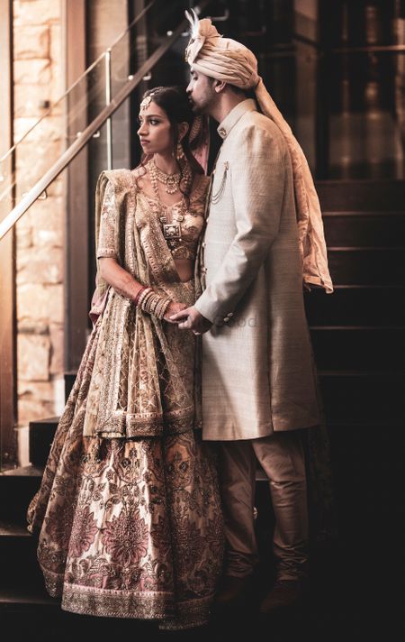 Photo of Coordinated couple portrait in gold outfits